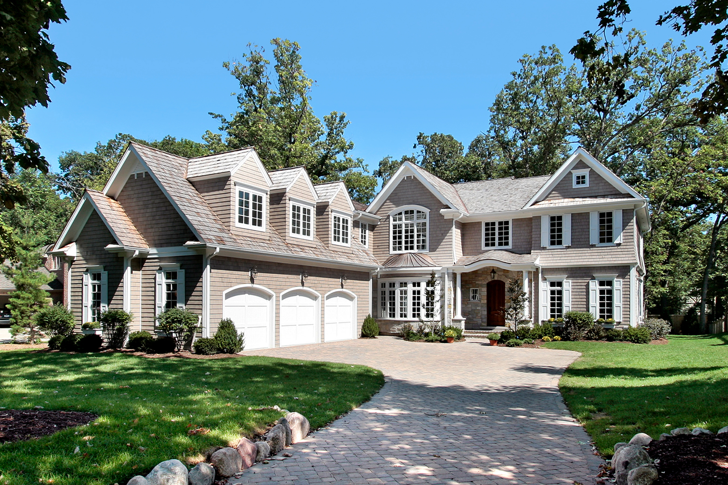 A large luxury home in a residential neighborhood