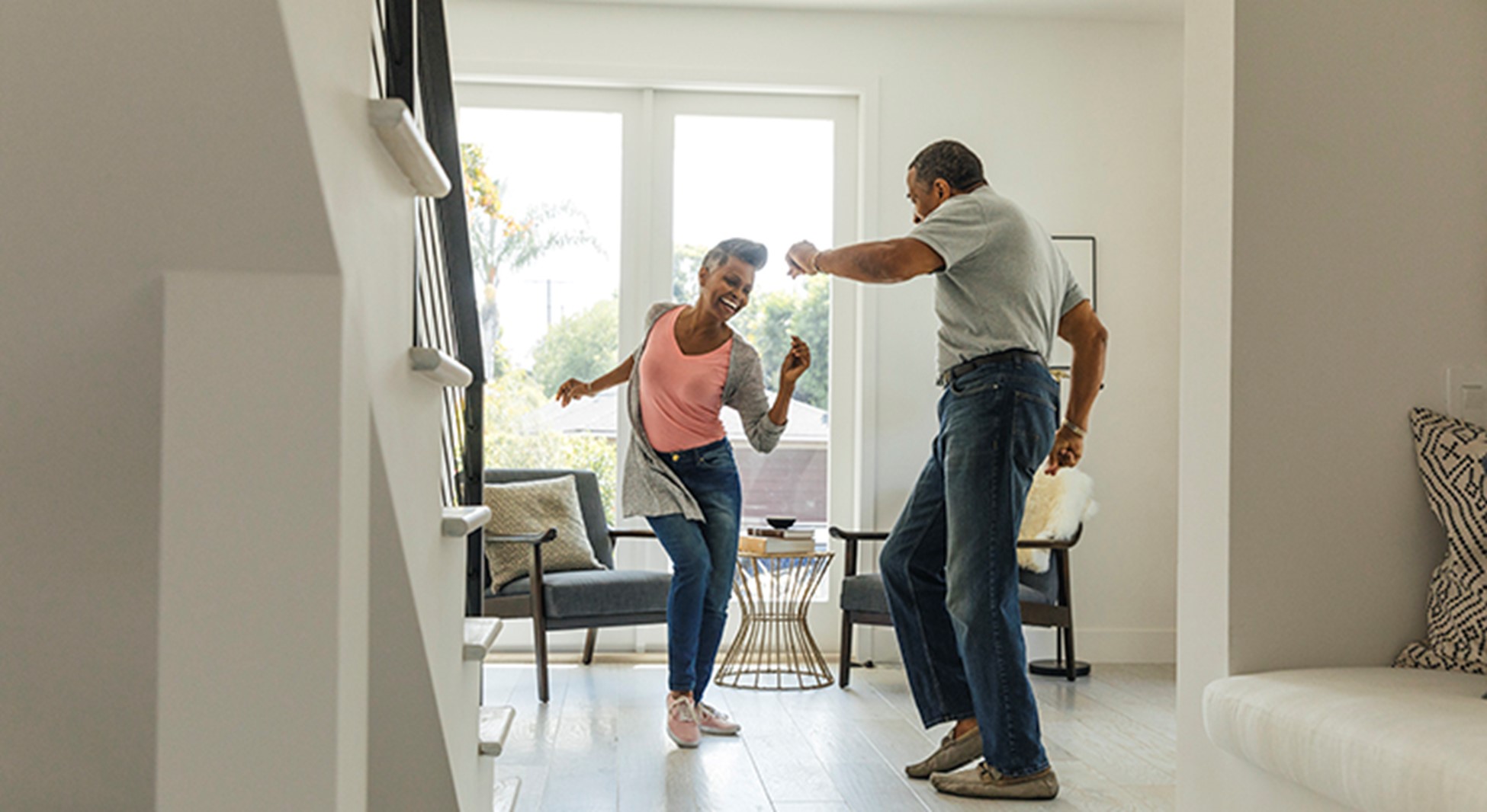 couple dancing in home